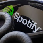 Spotify on a phone with headphones