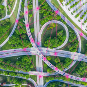 An overhead shot of a complicated highway junction, with data points connecting the cars.
