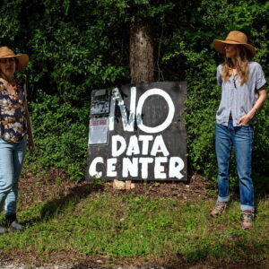 sisters and protest sign